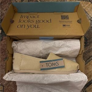 TOMS Cream Canvas Slip-Ons